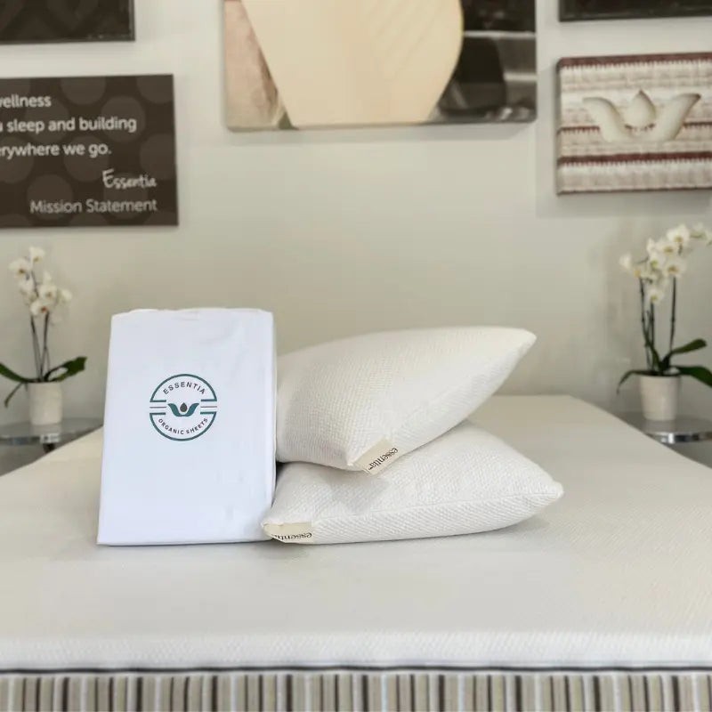 Essentia organic sheets and 2 latex cloud pillows sitting on an Essentia mattress