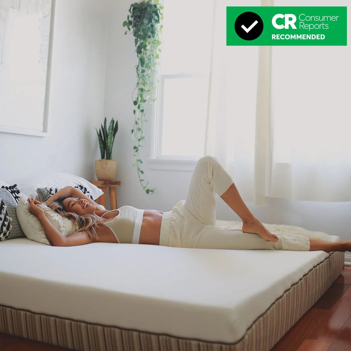 Woman laying down on Essentia Stratami organic mattress